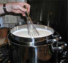 Stirring the cultures into the milk